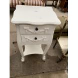 A MODERN WHITE BEDSIDE TABLE WITH TWO DRAWERS