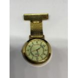 A YELLOW METAL PULSAR NURSES WATCH SEEN WORKING BUT NO WARRANTY