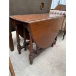 A MAHOGANY GATELEG DINING TABLE