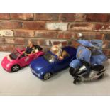 A BARBIE CALI GIRL CHEVROLET CAR WITH TWO BARBIE DOLLS PLUS TWO SCOOTERS AND PINK VW BEETLE CAR WITH