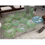 AN ASSORTMENT OF GREEN COLOURED GLASS WARE TO INCLUDE A VASE, JUGS AND DISHES ETC