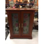 A TABLE TOP JEWELLERY CABINET WITH SECTIONAL DRAWERS AND A MULTIHOOK HANGER FOR NECKLACES, COSTUME