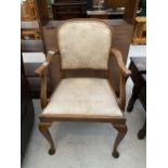 A MID 20TH CENTURY WALNUT ELBOW CHAIR