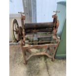 AN ANTIQUE LEWIS'S STANDEX CAST IRON MANGLE ON WHEELS (A/F) SEIZED COMPONENTS, WIDTH 82CM, HEIGHT