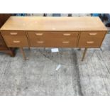 A RETRO TEAK DRESSING TABLE WITH SIX DRAWERS 59" WIDE