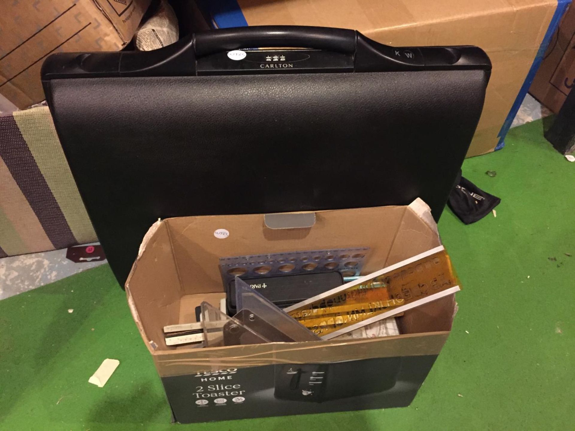 A COMBINATION BRIEFCASE AND A BOX OF STATIONERY ITEMS