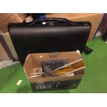 A COMBINATION BRIEFCASE AND A BOX OF STATIONERY ITEMS