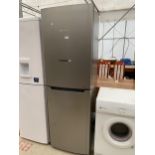 A SILVER HOTPOINT UPRIGHT FRIDGE FREEZER