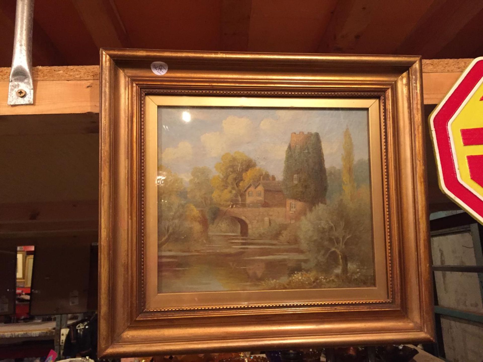 A GILT FRAMED OIL ON BOARD OF A MAN ON A BRIDGE FISHING. SIGNED H JAPMAN?? 1918