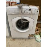 A WHITE HOTPOINT WASHING MACHINE