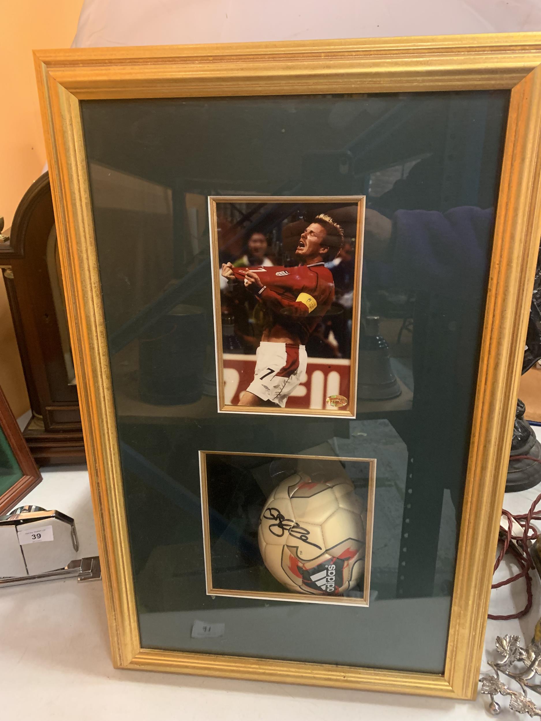 A FRAMED DAVID BECKHAM SIGNED FOOTBALL WITH CERTIFICATE OF AUTHENTICITY