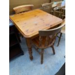 A MODERN PINE KITCHEN TABLE, 30" SQUARE AND TWO CHAIRS