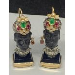 A PAIR OF BLACKAMORE, 14 CARAT GOLD, DIAMOND AND EMERALD EARRINGS IN AN AFRICAN BUST DESIGN