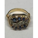 A 14 CARAT YELLOW GOLD RING WITH SAPPHIRES AND DIAMONDS IN A DECO STYLE SETTING GROSS WEIGHT 6 GRAMS