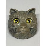 A CAT BROOCH WITH GLASS EYES