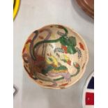 AN ENAMELLED ORIENTAL STONEWARE BOWL A/F