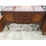 A MID 20TH CENTURY WALNUT SIDEBOARD ON CABRIOLE LEGS 54" WIDE