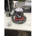 A SMALL BLACK AND DECKER DUSTBUSTER VACUUM