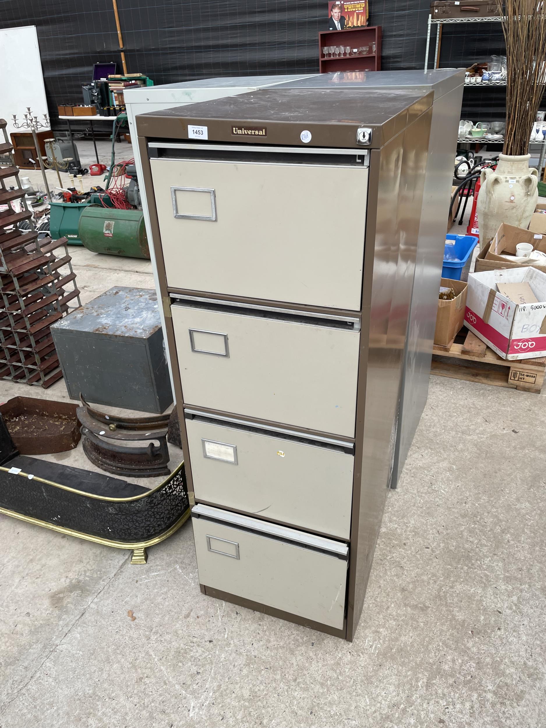A METAL FOUR DRAWER 'UNIVERSAL' FILING CABINET