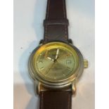 AN ASCOT WRISTWATCH WITH A BROWN LEATHER STRAP SEEN WORKING BUT NO WARRANTY