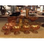 A QUANTITY OF AMBER COLOURED GLASS TO INCLUDE, IRRIDESCENT BOWLS, CARNIVAL GLASS, VASES, ETC