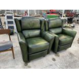 TWO GREEN LEATHER RECLINING ARM CHAIRS