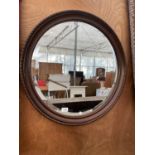 A WOODEN FRAMED WALL MIRROR