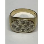 A HEAVY 9 CARAT GOLD RING WITH CLEAR STONE CHIPS GROSS WEIGHT 6 GRAMS IN A PRESENTAION BOX