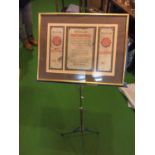 A BLUE ADJUSTABLE MUSIC STAND AND A FRAMED FRENCH POSTER
