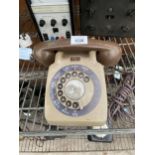 A RETRO BROWN ROTARY DIAL TELEPHONE