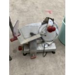 AN ELECTRIC MEAT SLICER