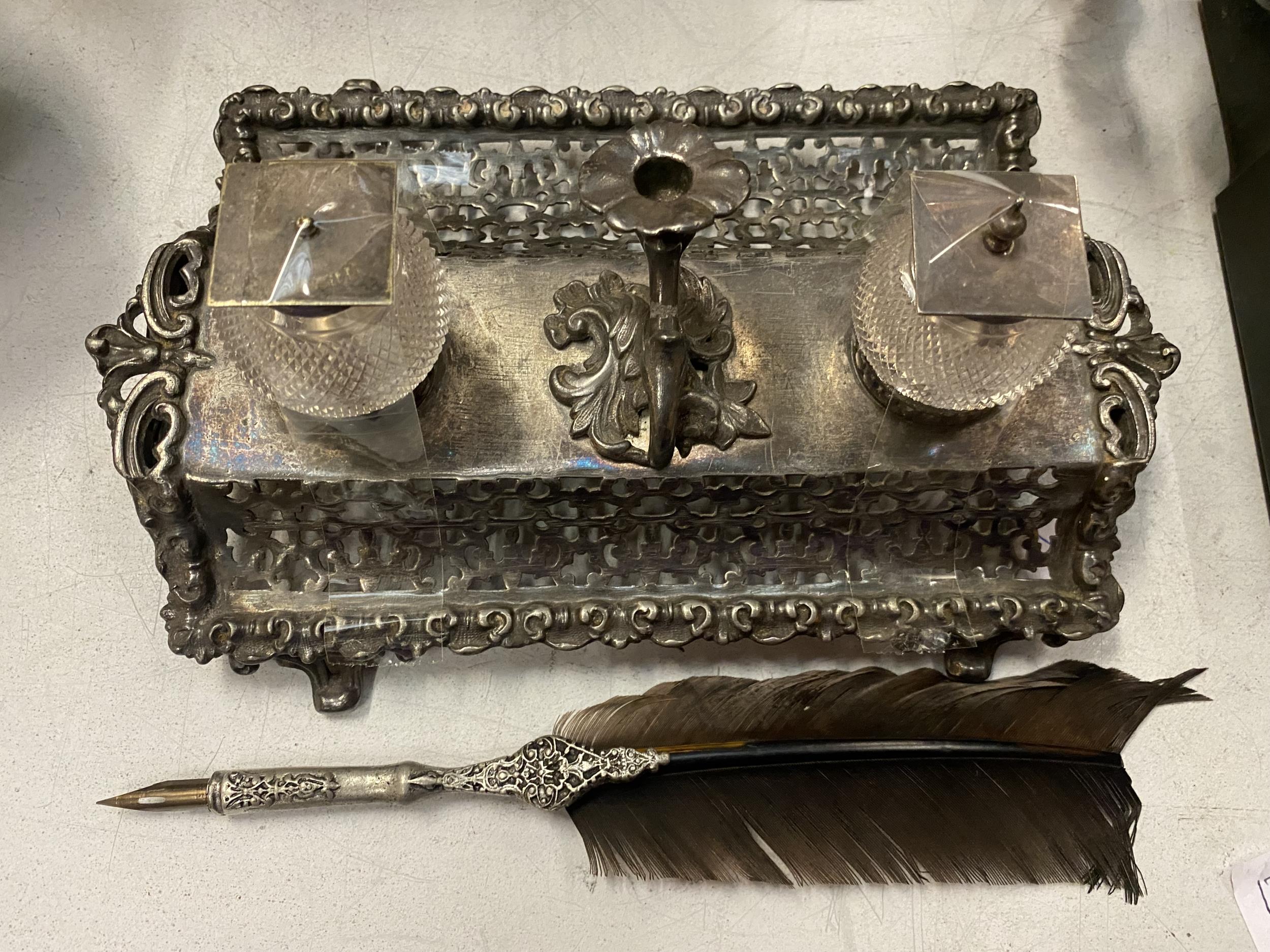 A WHITE METAL DESK SET AND INKWELL