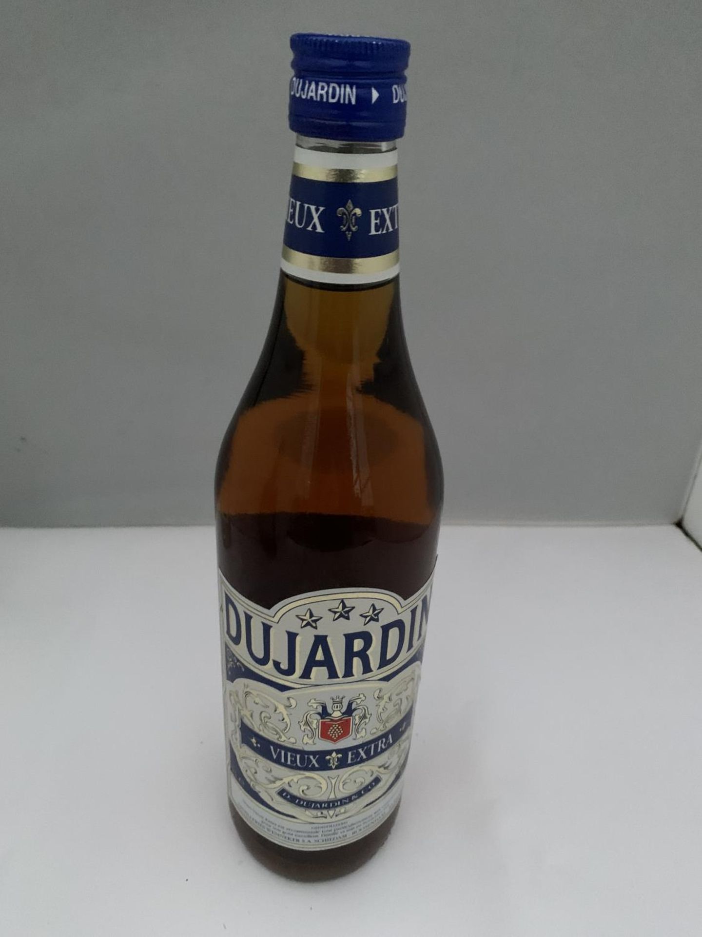 A 1 LITRE BOTTLE OF DUJARDIN VIEUX EXTRA