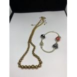 A SILVER GILT NECKLACE AND A SILVER PANDORA STYLE LOVE BRACELET WITH CHARMS