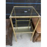 A BRASS FRAMED TWO TIER TABLE WITH GLASS SHELVES, 15.5" SQUARE