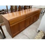 A RETRO TEAK MCINTOSH SIDEBOARD ENCLOSING THREE CUPBOARDS AND THREE DRAWERS 71" WIDE