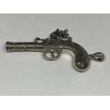 A PENDANT IN THE FORM OF AN ORNATE PISTOL