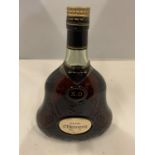 A BELL SHAPED BOTTLE OF HENNESSY COGNAC XO IN A BELL SHAPED DECORATIVE BOTTLE