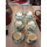 SIX VINTAGE BLUE AND WHITE CHINA TRIOS AND TWO SMALL ETCHED GLASS LAMPSHADES