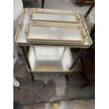 A 1970'S TWO TIER METALWARE TEA TROLLEY BY 'FOLTROY' QUICKFOR LTD AND TWO SMALL MATCHING TROLLEYS
