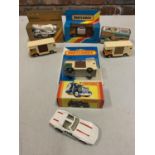 A COLLECTION OF BOXED AND UNBOXED MATCHBOX VEHICLES - ALL MODEL NUMBER 40 OF VARIOUS ERAS AND