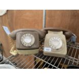 A RETRO GREY ROTARY DIAL TELEPHONE AND A FURTHE RETRO DIAL TELEPHONE