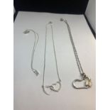 THREE MARKED SILVER NECKLACES AND PENDANTS TO INCLUDE A HEART AND BUTTERFLY, A DOUBLE HEART WITH