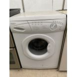 A WHITE HOTPOINT WASHING MACHINE