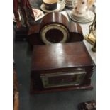 AN ART DECO MAHOGANY CASED MANTLE CLOCK AND A MAHOGANY CASED NAPOLEONS HAT MANTLE CLOCK