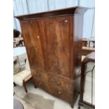 A 19TH CENTURY MAHOGANY PRESS CUPBOARD CONVERTED TO A WARDROBE, HAVING TWO PANELLED CUPBOARD DOORS