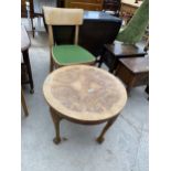 A WALNUT AND CROSSBANDED COFFEE TABLE ON CABRIOLE LEGS AND A KITCHEN CHAIR