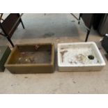 A BROWN SALT GLAZED TROUGH AND A FURTHER WHITE BELFAST SINK