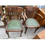 A PAIR OF EARLY 20TH CENTURY OAK OFFICE ELBOW CHAIRS