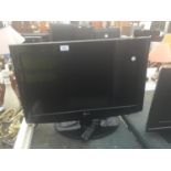 A 26" LG TELEVISION WITH REMOTE CONTROL